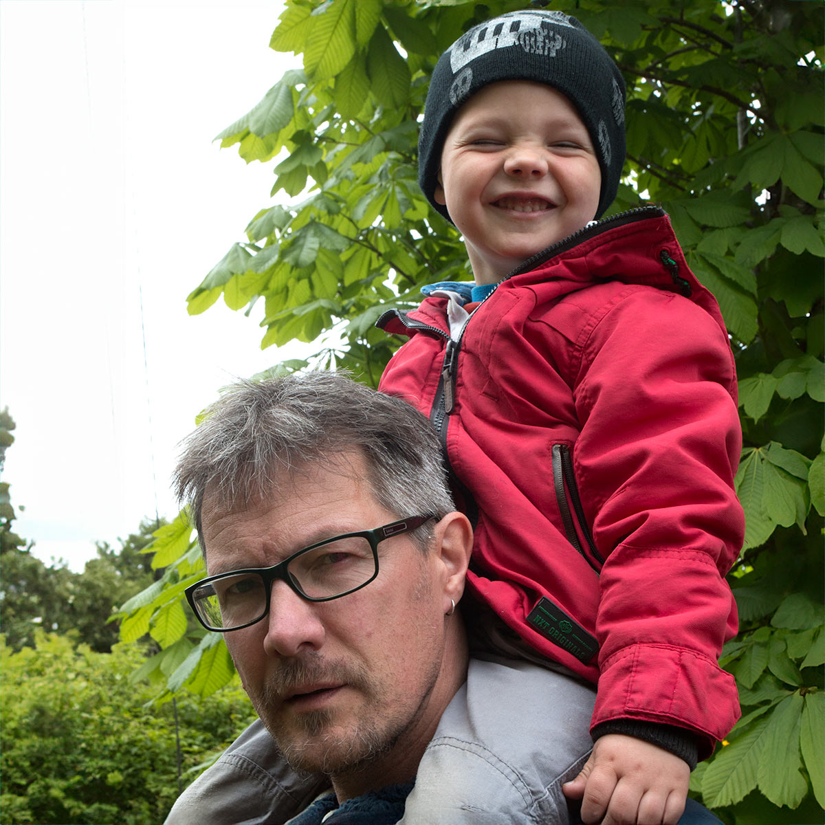 Andy Smith, founder of YourWebSmith, with his son on his shoulders